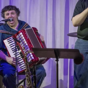 Catfish-Howl's Glen Robertson playing accordion live on stage